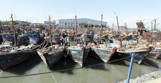 A number of Chinese fishing boats that were caught while operating illegally in Korea's exclusive zone are moored at a port in Incheon, South Korea on Monday.