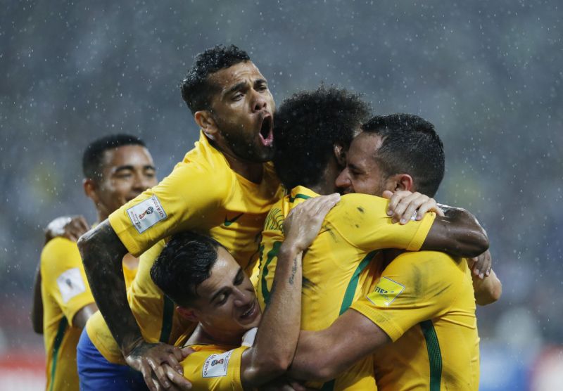 Brazil's players celebrate after teammate Willian scoring the second goal against Venezuela during a 2018 World Cup qualifying soccer match in Merida, Venezuela on Tuesday.