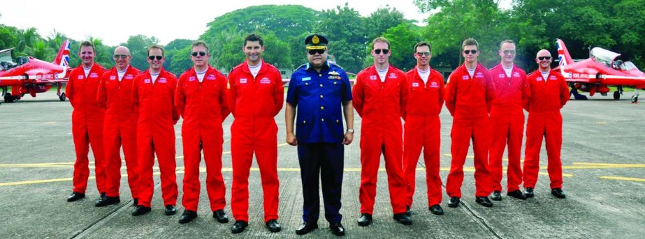 Chief of Air Staff Air Chief Marshal Abu Esrar poses for photograph with the British Royal Air Force Aerobatics team members at BAF tarmac during their brief stop over in Dhaka on Thursday.