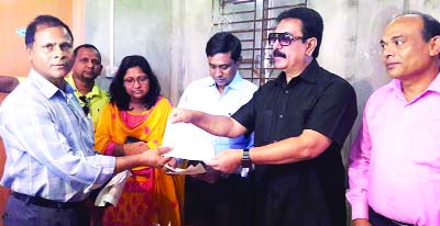 RANGPUR: State Minister for Local Government Rural Development and Co-operatives Mashiur Rahman Ranga distributing cheques for price of acquired land among land owners at a ceremony held at Taraganj Upazila as the Chief Guest on Thursday.