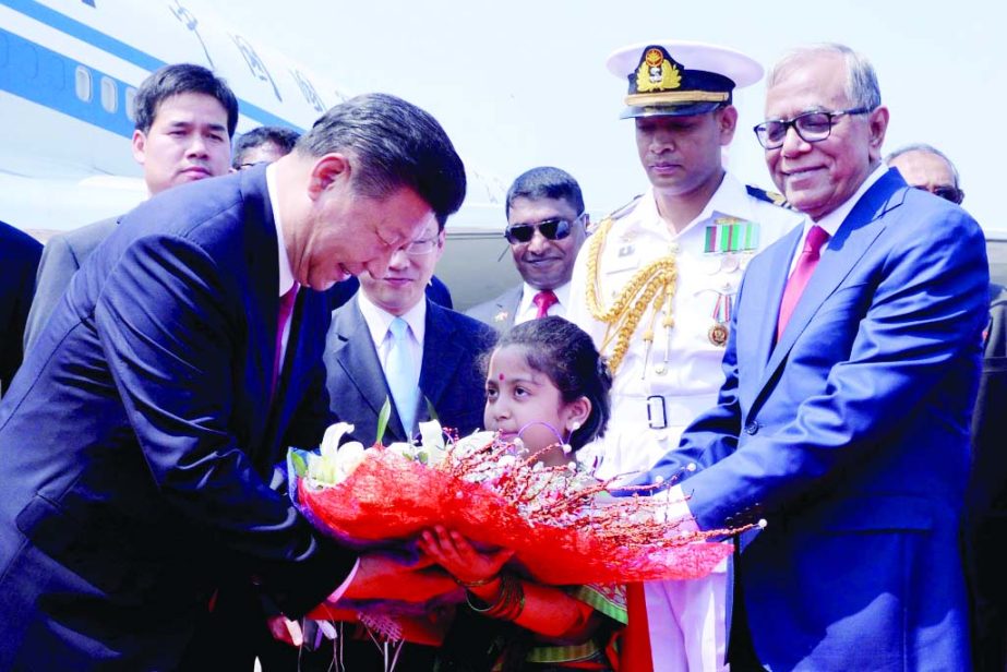 A child welcomed Chinese President Xi Jinping with a bouquet upon his arrival at Hazrat Shahjalal International Airport in the city on Friday. President Abdul Hamid was present during the time.