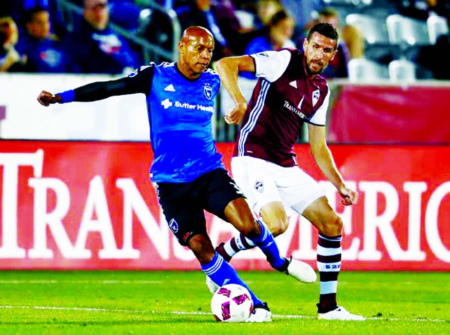 San Jose Earthquakes defender Jordan Stewart (left) kicks the ball away from Colorado Rapids forward Sebastien Le Toux in the first half of an MLS soccer game in Commerce City, Colo on Thursday.
