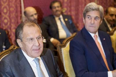 Russian Foreign Minister Sergey Lavrov (left) and US Secretary of State John Kerry (right) attend a bilateral meeting where they discussed the crisis in Syria in Lausanne, Switzerland on Saturday