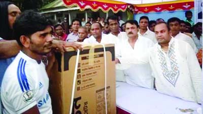 MANIKGANJ: A M Naimur Rahman Durjoy MP distributing prizes among the winners of Late Prof A M Saidur Rahman Smriti Football League at PS Model High School premises in Daulatpur Upazila on Friday.