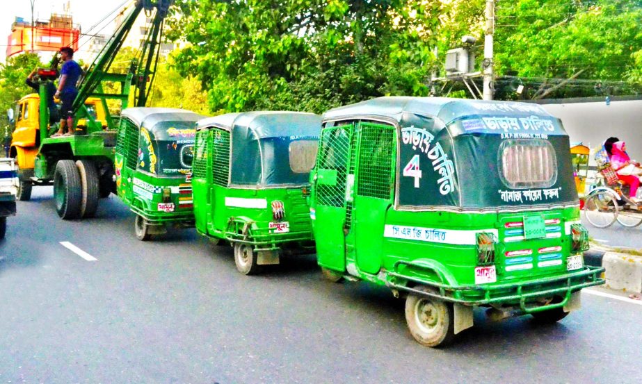 Unfit, licenceless CNG-run vehicles being pulled out of city roads by Recker as BRTA launched a special drive in a bid to ease the worsening traffic congestion. This photo was taken from Paltan area on Sunday.