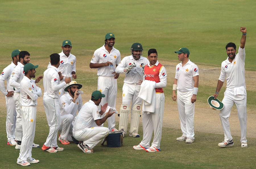 Pakistani cricketers celebrate after the dismissal of West Indies batsman Jermaine Blackwood on the final day of the first day-night Test between Pakistan and the West Indies at the Dubai International Cricket Stadium in the Gulf Emirate on Monday.