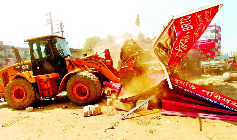 Dhaka South City Corporation in a desperate bid evicted illegal establishments at the busiest Sayedabad area to facilitate transport system. This photo was taken on Monday.