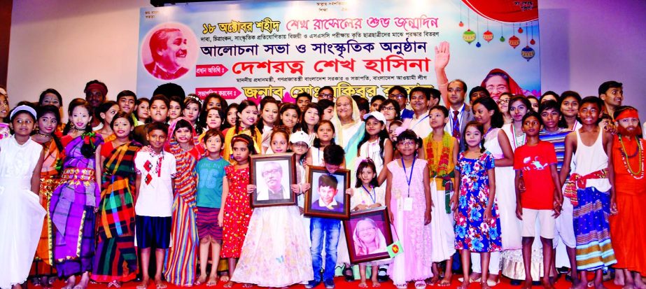 Prime Minister Sheikh Hasina poses for photograph along with juvenile children at Bangladesh Krishibid Institution in the city's Khamarbari on Tuesday on the occasion of birthday of Sheikh Russel, youngest son of Father of the Nation Bangabandhu Sheikh M