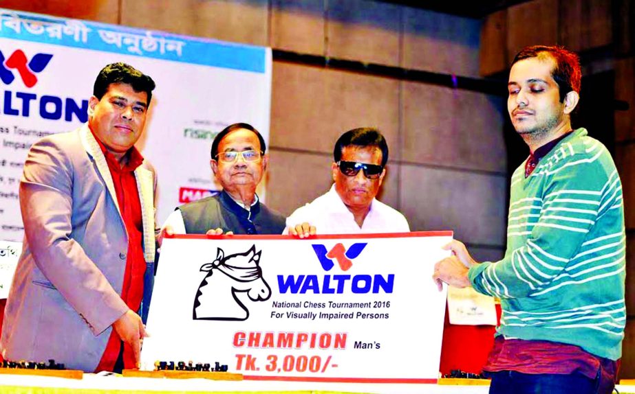 Railway Minister Md Mujibul Haque, MP (second from left) handing over the cheque of Taka three thousand to Hussain Izaz, the champion of the Walton Chess Tournament for Blind at Bangladesh Chess Federation hall-room on Tuesday.