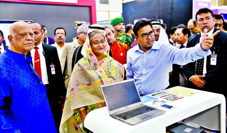 Prime Minister Sheikh Hasina visiting stalls at the Bashundhara International Convention City 'Digital World-2016' Conference after inauguration on Wednesday.
