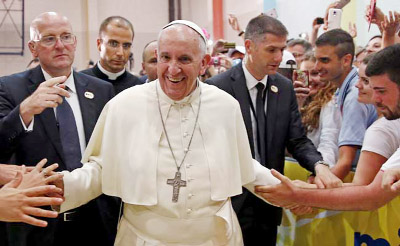 Pope Francis meets people in a youth centre dedicated to Pope John Paul II during his visit to Sarajevo.