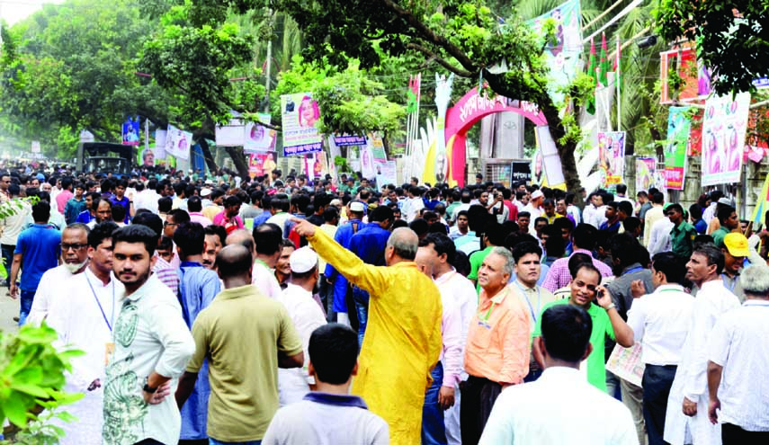 A large number of people crowd the streets around the Suhrawardy Udyan on the occasion of 20th Council of Bangladesh Awami League. The snap was taken from in front of the Bangla Academy in the city on Saturday.