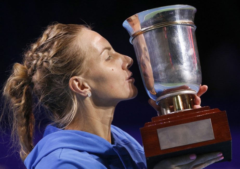 Russia's Svetlana Kuznetsova kisses her trophy as she won the first place at the Kremlin Cup tennis tournament against Australia's Daria Gavrilova in Moscow, Russia, Saturday