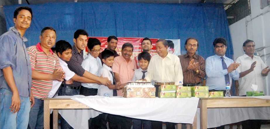 Members of Bangabandhu and Jatiyo Char Neta Smriti Sangsad cutting cake on the occasion of the 53rd birthday of Sheikh Russel recently.