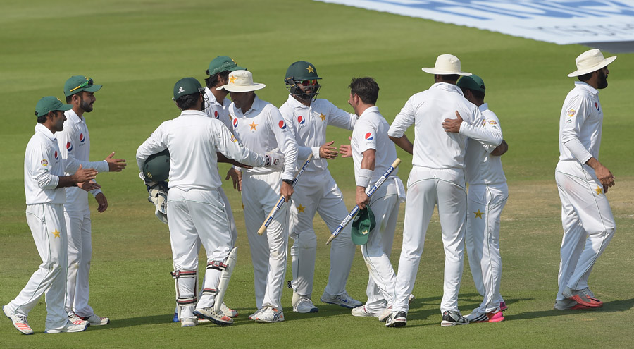 Pakistani players embrace each other after their win against West Indies in 2nd Test at Abu Dhabi on Tuesday.