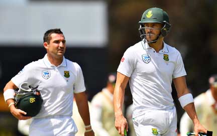 (L-R) Dean Elgar and Faf du Plessis of South Africa walk from the ground at lunch during the Tour match between South Australia and South Africa at Gliderol Oval in Adelaide, Australia on Thursday.