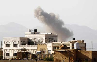 Smoke billows from buildings following a reported air strike carried out by the Saudi-led coalition in the Yemeni capital Sanaa.