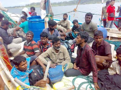 Australia-bound Sri Lankan asylum-seekers are seen off western Sumatra, after being intercepted by Indonesian authorities.