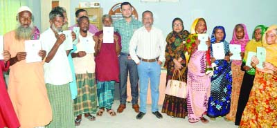 MYMENSINGH: Kamrul Islam Md Walid, Chairman, Mymensingh Sadar Upazila distributing allowance and book organised by Social Welfare Ministry at Upazila Parishad recently.