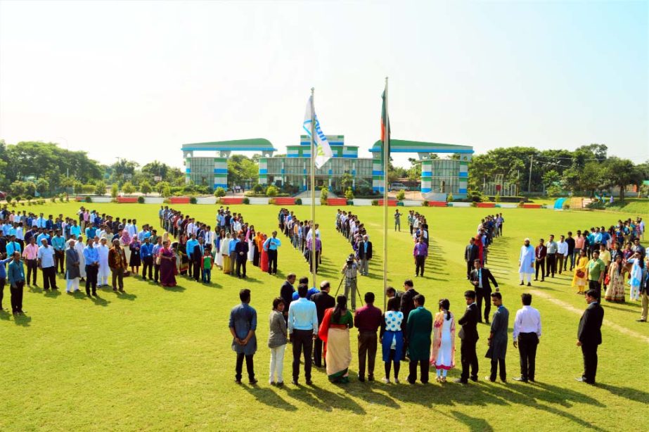 Parents, students and teachers of the Daffodil International University jointly rendering national anthem at the inaugural ceremony of Orientation Program of Fall Semester-2016 at University campus on Saturday.