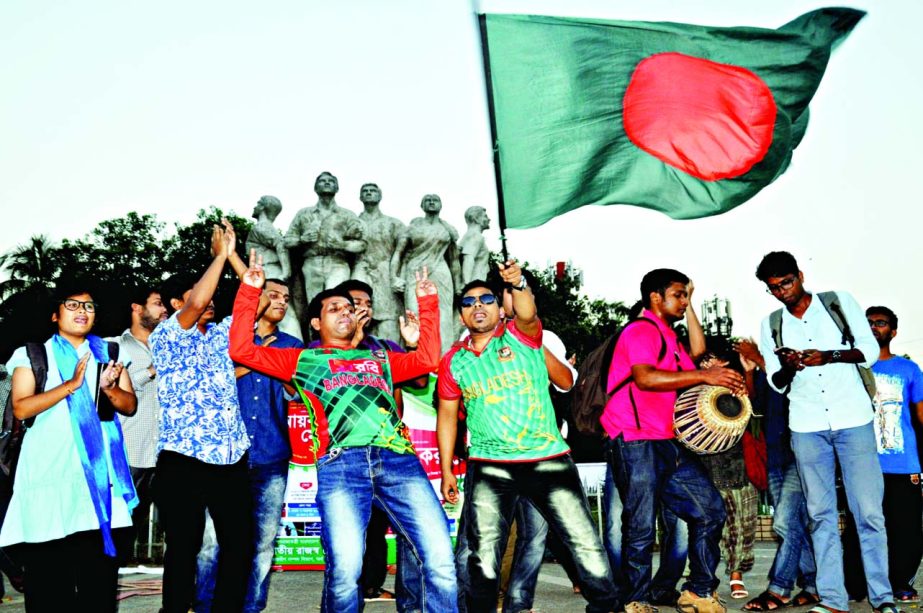 Students carrying the national flag celebrating the victory of Bangladesh against England on the 2nd Test match held in Mirpur Sher-e-Bangla National Cricket Stadium. This photo was taken from Dhaka University on Sunday.