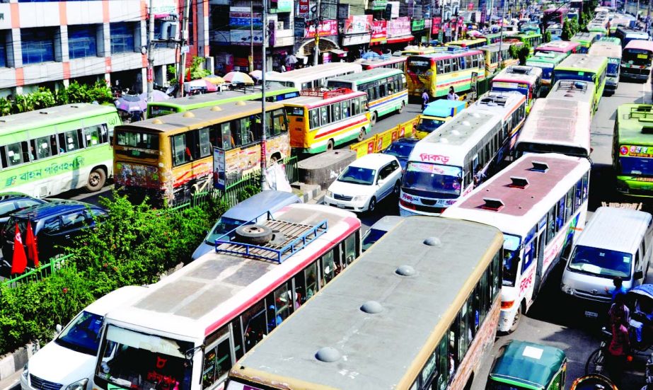 City experiences huge traffic gridlock on the first day after weekly holiday causing sufferings to commuters. This photo was taken from Topkhana Road on Sunday.