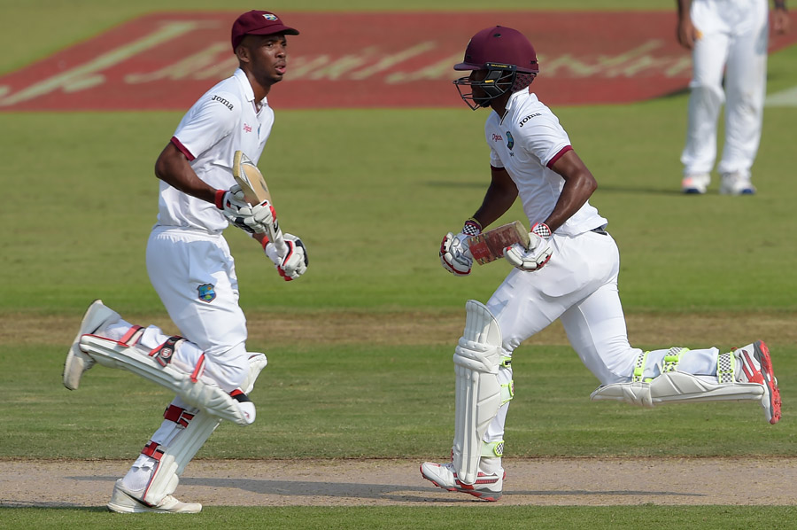 Roston Chase and Kraigg Brathwaite complete a run during their partnership of 83 on the 2nd day of 3rd Test between Pakistan and West Indies at Sharjah on Monday.