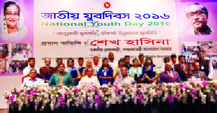 Prime Minister Sheikh Hasina poses for photograph with the prize winners who contribute for the development of youths at the inaugural function of National Youth Day-2016 at Osmani Memorial Auditorium in the city on Tuesday. BSS photo