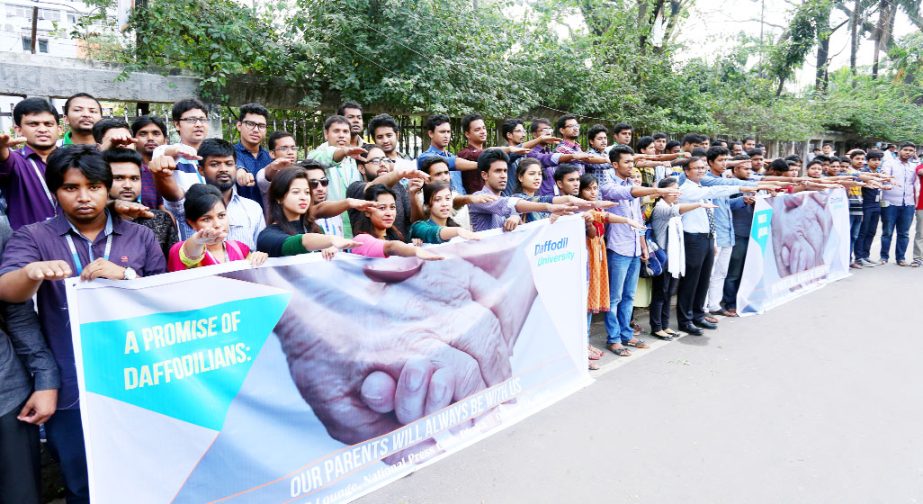 Students of Daffodil International University taking oath regarding "A Promise of Daffodilians: Our Parents will always be with us"" in front of the National Press Club in the capital on Monday."