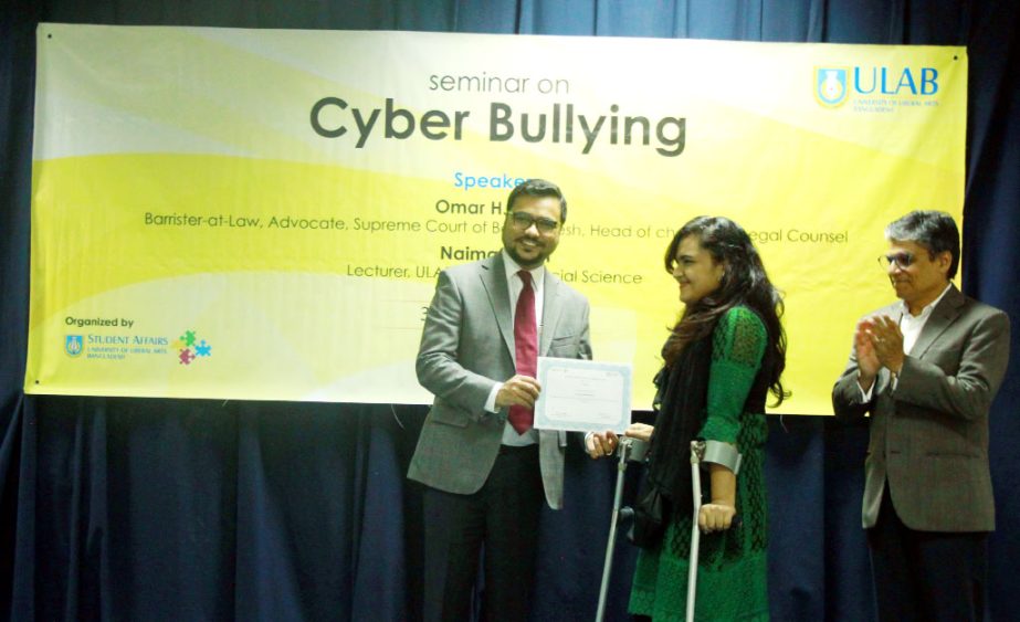 Acting Vice Chancellor of University of Liberal Arts Bangladesh Prof Imran Rahman distributes certificates among the winners of a presentation contest titled: "What are the Psychological Benefits and Drawbacks of Social Media?"" held at the University Ca"