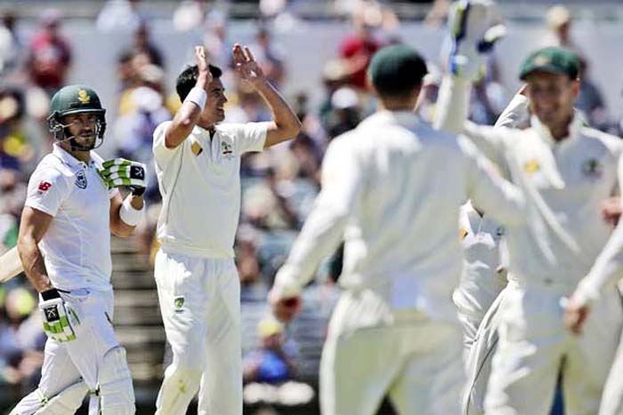 Australia's Josh Hazlewood (center) celebrate with his team after taking the wicket of South Africa's Hashim Amla for a duck on the first day of play in their cricket Test match against South Africa in Perth, Australia on Thursday.