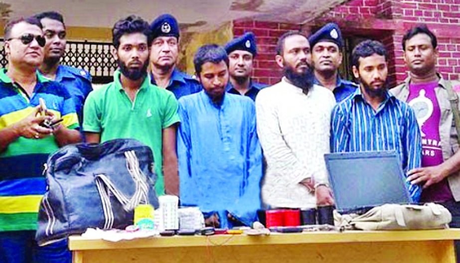 Four suspected members of Jama\'atul Mujahideen Bangladesh along with fire arms and explosive were arrested from Doratana Bridge area of Bagerhat district on Thursday.