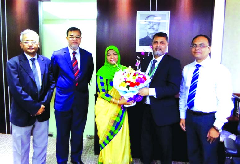 Mohammodi Khanam, CEO of Prime Insurance Company Ltd (PICL) greets Mamun-Ur-Rashid, newly appointed Managing Director of Standard Bank Ltd (SBL) with a flower bouquet in the city recently. Md. Motaleb Hossain, DMD of SBL, Syed Monirul Huq, Deputy Managing