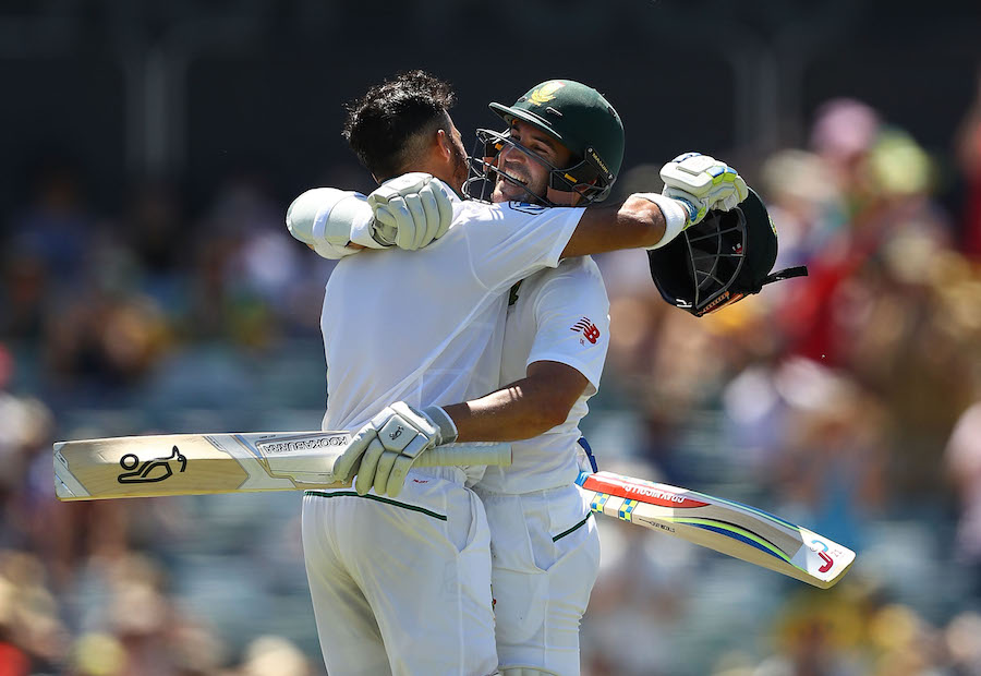 Jean-Paul Duminy of South Africa celebrates with Dean Elgar of South Africa after reaching his century during day three of the first Test match between Australia and South Africa at WACA in Perth, Australia on Saturday.
