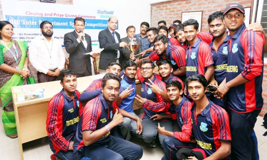 Prof Dr Yousuf M Islam, Vice-Chancellor of Daffodil International University handing over the Champion Trophy of DIU Inter Department Cricket Tournament- 2016 to the players of Textile Engineering (TE) Department held recently at the permanent campus of t