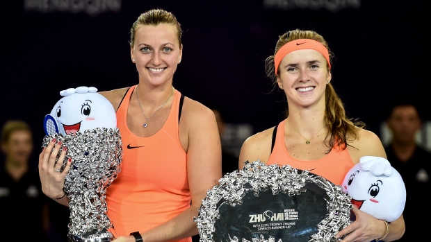 Petra Kvitova and Elina Svitolina pose for photo with their trophies in Zhuhai on Sunday.