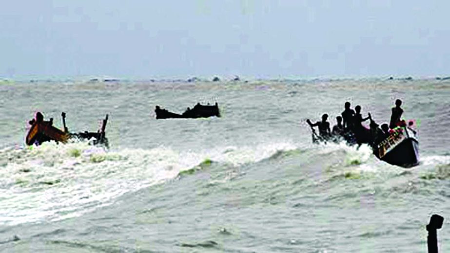 Fishermen searching their fellows who are believed to have drowned along with eight trawlers at Dublar Char near Sundarbans during storm at Bay of Bengal on Saturday night.