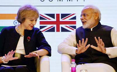 Prime Minister Narendra Modi, British PM Theresa May at TECH summit in Delhi on Monday.