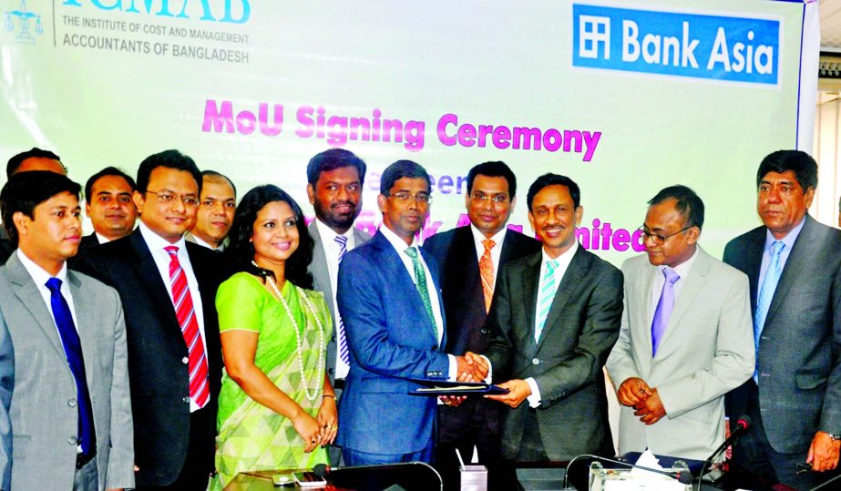 Md Arfan Ali, Managing Director of Bank Asia Ltd and Arif Khan President of Institute of Cost and Management Accountants of Bangladesh (ICMAB) exchanging documents after sign a MoU on e-Payment Services in the city recently. Imran Ahmed, Chief Financial O