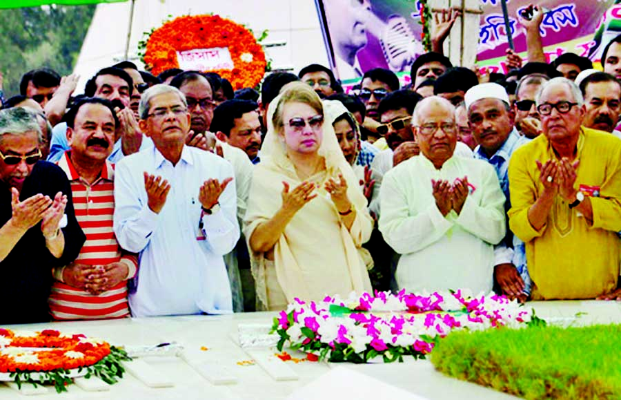 BNP Chairperson Begum Khaleda Zia along with party colleagues offering munajat after paying floral tributes at the mazar of Shaheed President Ziaur Rahman on Monday marking National Revolution and Solidarity Day.