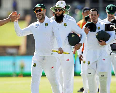An ecstatic Faf du Plessis leads his victorious team off the field on the 5th day of 1st Test between Australia and South Africa at Perth on Monday.