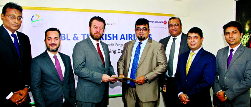 M Nazeem A Choudhury, Head of Consumer Banking of Eastern Bank Ltd (EBL) and Murat Irdesel, General Manager of Turkish Airlines Inc Dhaka, exchange documents after signed an agreement in the city recently. Under the deal, Turkish Airlines business class p