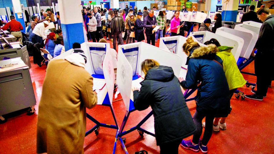 Voters cast ballots during voting in New York city on Tuesday morning.