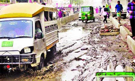 This road at Chankharpool near Dhaka Medical College Hospital is in dilapidated condition causing sufferings to commuters, and students. This photo was taken on Wednesday.