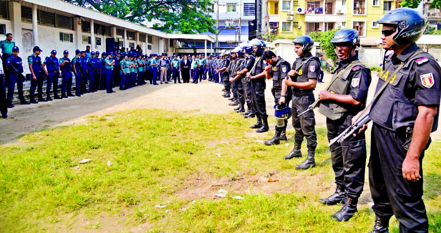 Law enforcers stand guard at the special court in the city's Bakshi Bazar Alia Madrasha premises on Thursday for BNP Chairperson Begum Khaleda Zia's appearing before the court for corruption case filed by Anti-Corruption Commission.