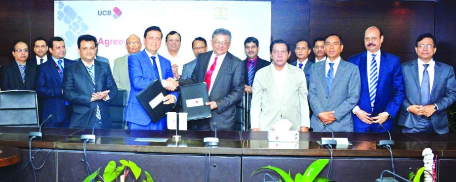 Muhammed Ali, Managing Director of United Commercial Bank Limited and Abu Khair Mohammad Sakhawat, President of Gulshan Club exchange document after signing a MoU in the city on Wednesday. MA Sabur, Chairman, M Shahidul Islam and Mirza Mahmud Rafiqur Rah