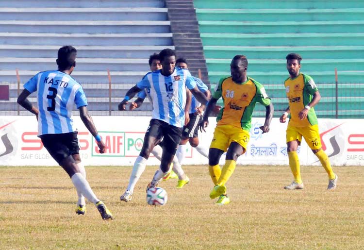 An action from the match of the JB Group Bangladesh Premier League Football between Rahmatganj MFS and Sheikh Jamal Dhanmondi Club Limited at the Bir Muktijoddha Rafiquddin Bhuiyan Stadium in Mymensingh on Thursday.