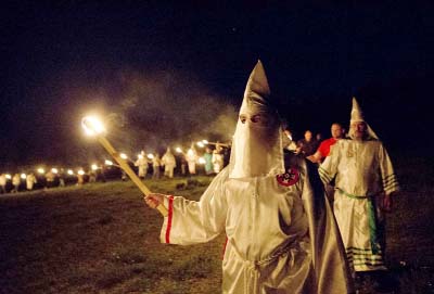 Members of the Ku Klux Klan participate in cross burnings after a "white pride" rally in rural Paulding County near Cedar Town, Ga.