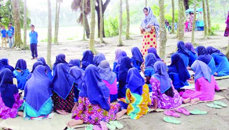 CHANDPUR: Students of Farazikandi Govt Primary School at North Matlab Upazila attending classes under open sky due to shortage of classroom.