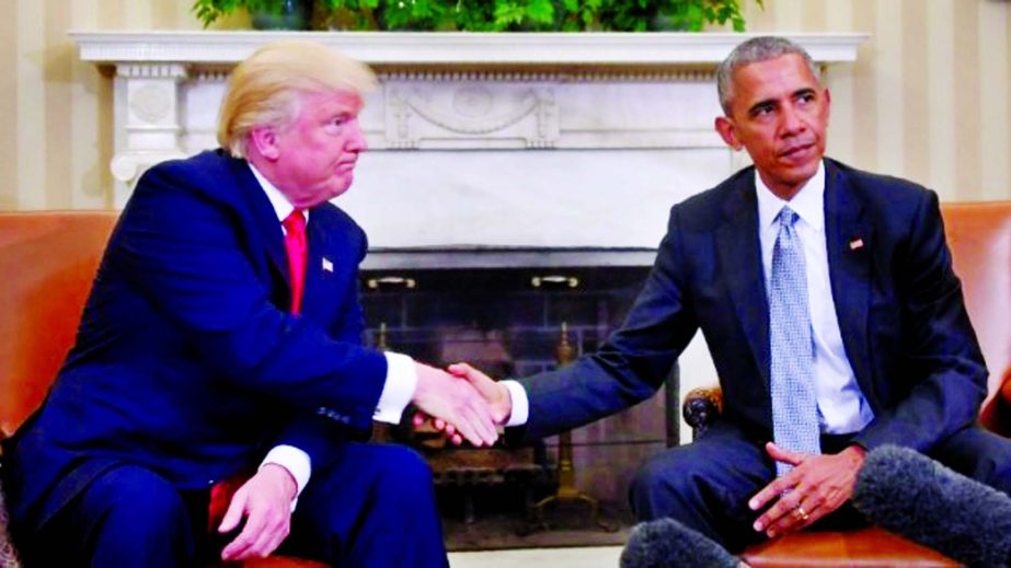US President Barack Obama and President-elect Donald Trump shake hands during a transition planning meeting in the Oval Office at the White House on Thursday in Washington, DC.
